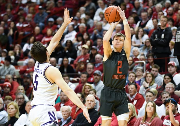 Indiana Hoosiers guard Gabe Cupps (2) makes a three-point basket over Northwestern Wildcats guard Ryan Langborg (5) at Simon Skjodt Assembly Hall.